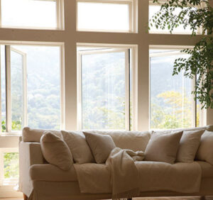 Interior view of opened casement windows in a living room