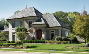 Beautiful slate roof on a large house with stunning landscaping