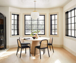 Casement windows looks good with sitting chairs and table